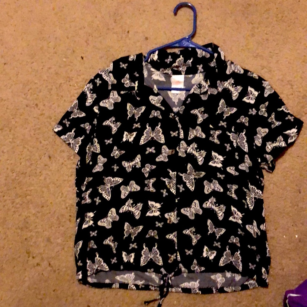 Black button up shirt with white butterflies all over.
